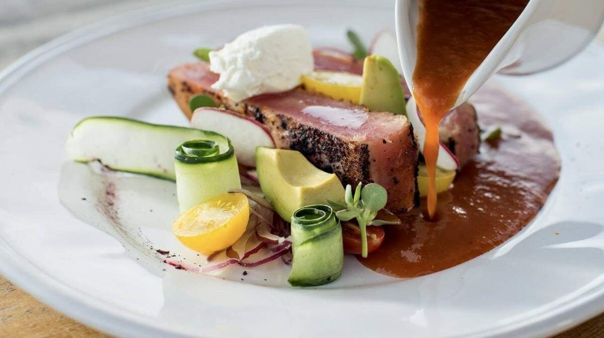 Ancho hibiscus blackened crusted tuna, jocoque, shaved fennel avocado & onion salad served with chipotle sauce at Quince, a San Miguel de Allende restaurant opening in Fort Worth.