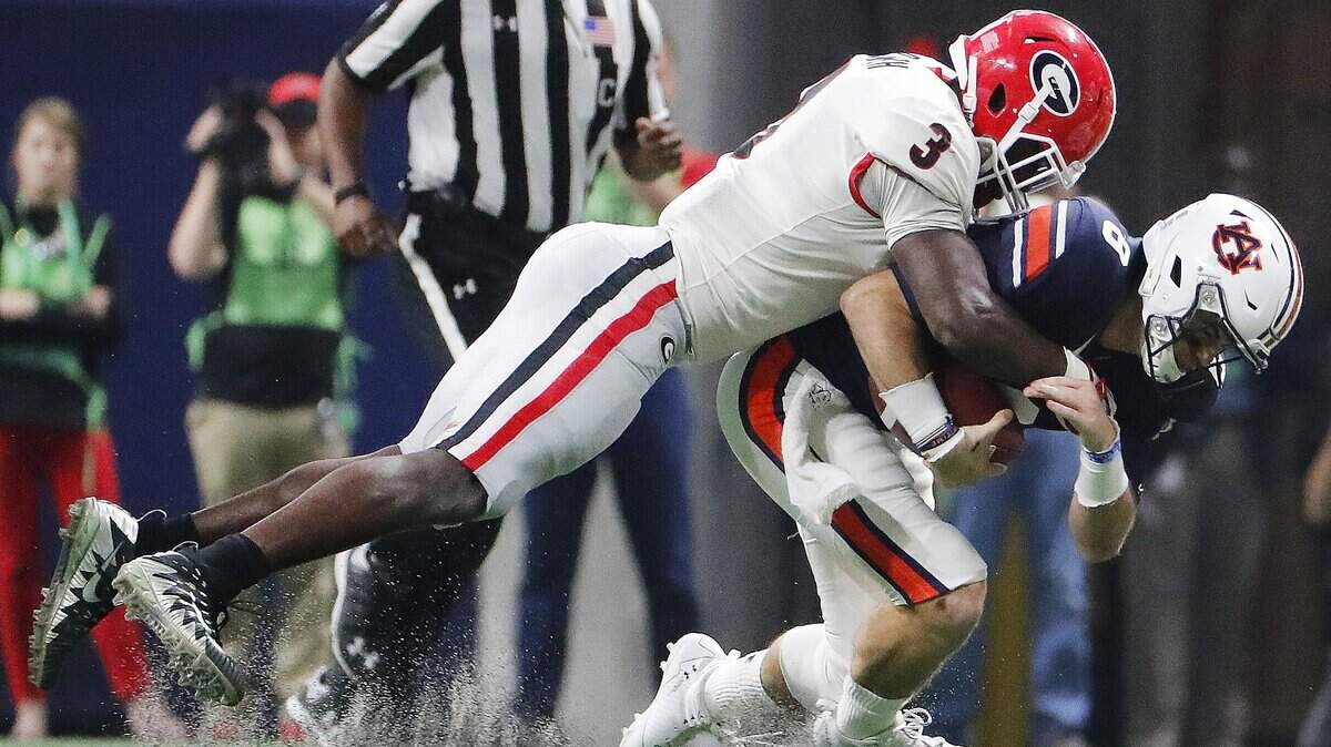 Georgia linebacker Roquan Smith (3), tackling Auburn quarterback Jarrett Stidham in the Southeastern Conference championship game, would solidify the Cowboys' defense.