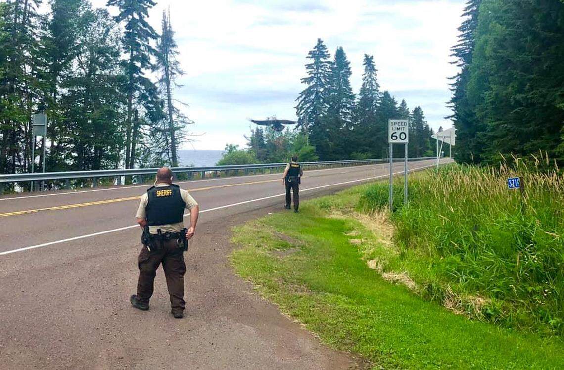 Members of the The Cook County Sheriff’s Office look on as the eagle soars above their heads.