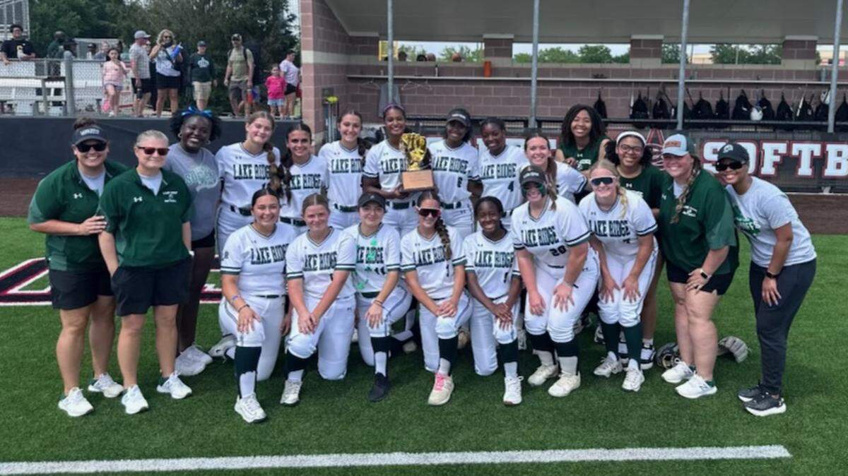 The Mansfield Lake Ridge softball team poses with the trophy after defeating Keller Timber Creek to win Game 3 of the Class 6A Division 1 bi-district series on Saturday, April 26, 2025 at the Coppell Softball Complex in Coppell, Texas.