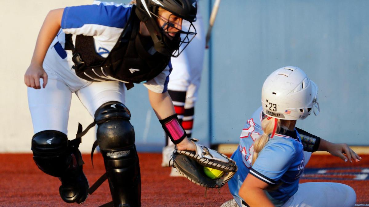 Richland catcher Landri McKittrick (23) escapes the tag of Brewer catcher Gracie Jester (7) during a 5A Region I Bi-District softball playoff game at Brewer High School in White Settlement, Texas, Friday, April 30, 2022. Richland defeated Brewer 12-3 to move on to the next round. (Special to the Star-Telegram Bob Booth)