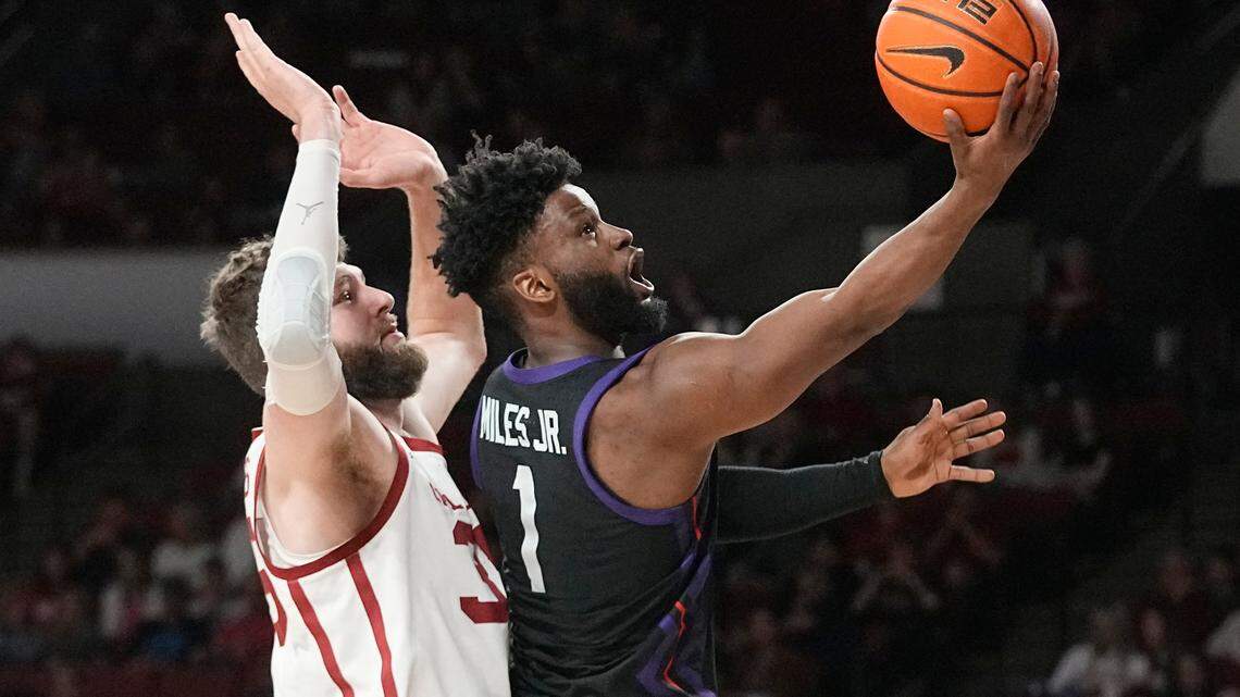 TCU guard Mike Miles Jr. (1) shoots in front of Oklahoma forward Tanner Groves, left, during their Big 12 game on Saturday.