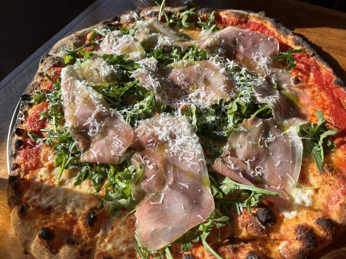 The Emilia Romana pizza has a margherita base with prosciutto and arugula at Felina in Fort Worth.