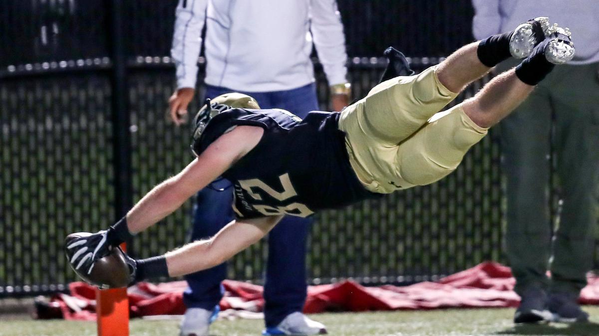 Birdville wide receiver Austin Hamilton (82) dives into the end zone for a 19-yard touchdown against Colleyville Heritage during the first half, Friday night, November 2, 2018 at Birdville ISD Fine Arts Athletics Complex. Birdville scored 27 points in the third quarter and won 51-24 to remain undefeated this season.