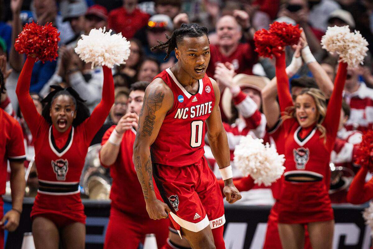 NC State guard DJ Horne (0) celebrates after making a floater in the second half of the Elite 8 South Regional Championship game against the Duke Blue Devils of NCAA Division I Mens Basketball Tournament at American Airlines Center in Dallas on Sunday, March 31, 2024. NC State defeated Duke 76-64.