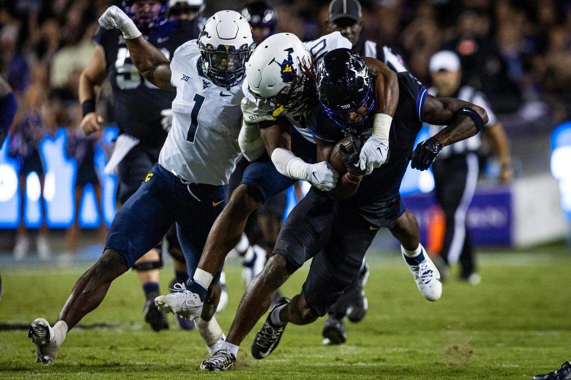 TCU wide receiver Savion Williams (3) gets tackled in the second half of a Big XII conference game between the TCU Horned Frogs and the West Virginia Mountaineers at Amon G. Carter Stadium in Fort Worth on Saturday, Sept. 30, 2023. The Horned Frogs lost 24-21.