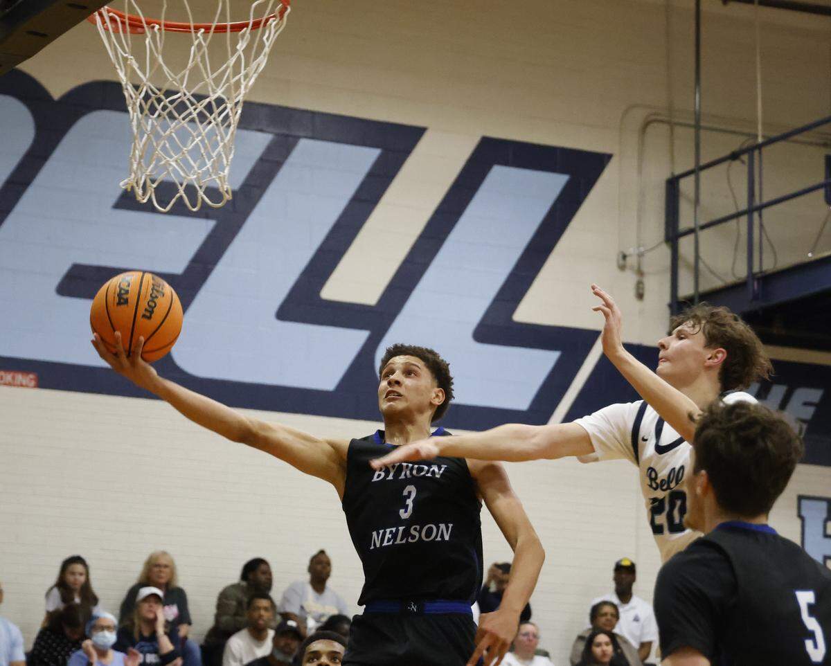 L.D. Bell forward Jesse Mikus (20) attempts to block the shot of Byron Nelson guard Romejo Waits (3) during the second half of a boys UIL basketball game between Byron Nelson and L.D. Bell at L.D. Bell High School in Hurst, Texas, Friday Feb. 06, 2026