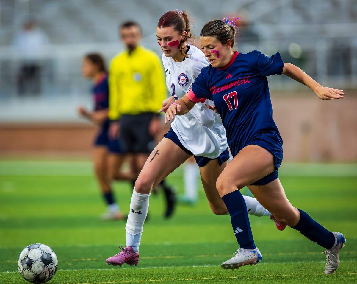 Grapevine’s Chloe O’Steen (2), in white, battles for the ball against a Wichita Falls Memorial defender in a Class 5A Division 2 regional semifinal on Friday, March 27, 2026, at Mineral Wells High School in Mineral Wells, Texas.