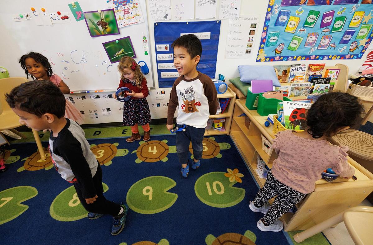 Children dance and play while being cared for at the Center for Transforming Lives Arlington Child Development Center on Friday, March 28. The facility has a partnership with UTA which allows full-time students to apply for a child care tuition scholarship offered through the university. This semester 18 students received the scholarship.