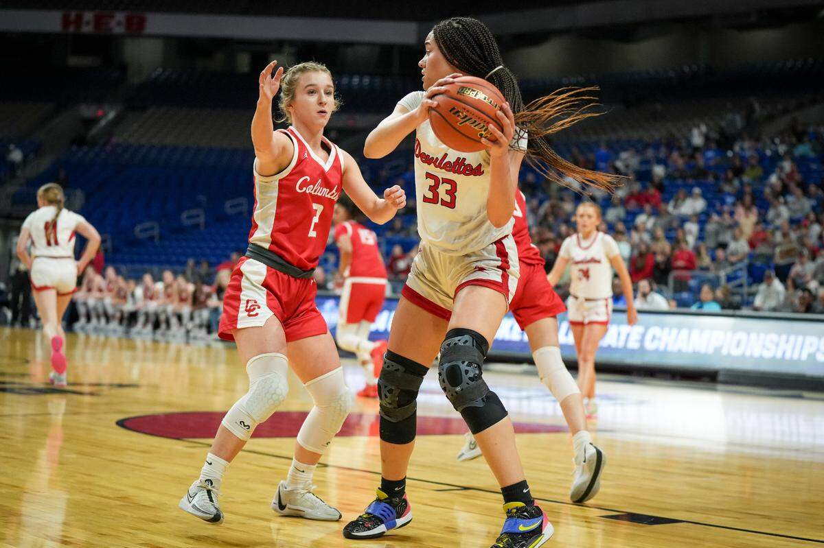Huntington forward Kyra Anderson pulls down one of her game-high 17 rebounds as the Devilettes downed Columbus 47-33 in a Class 3A state semifinal on Thursday, February 29, 2024 at the Alamodome in San Antonio, Texas.