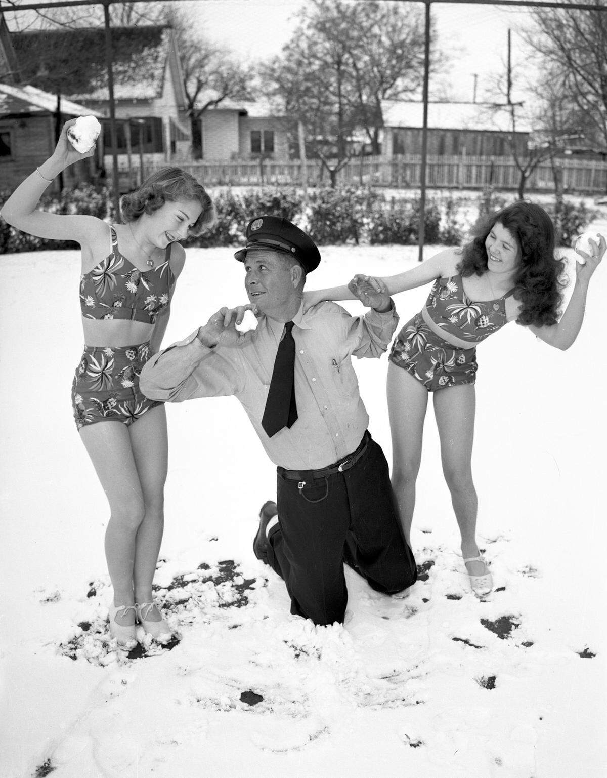 Jan. 3, 1942: “Snow maids subdued a husky fireman Saturday after he dared ‘em to snowball duel in costume they were wearing for Recreation Department dance. Girls are Gerry Christopher (left), and Jackie Clardy. Fireman is J. M. Hester.”