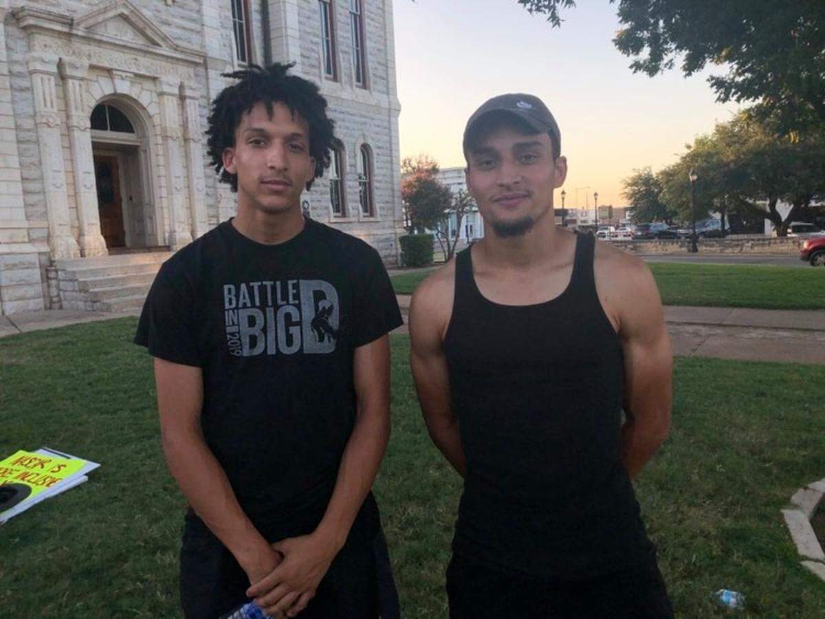 Michael Gray (left) and Tyler Gray (right) joined a protest at the Parker County Courthouse in Weatherford where protesters demanded a Confederate statue be removed from the lawn on Monday, Aug. 9.