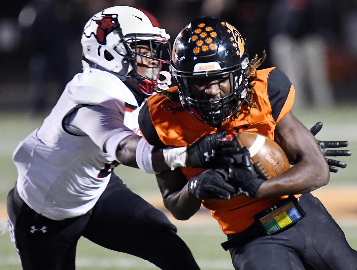 Cedar Hill’s Stefan Ingram, left tries to catch Aledo’s Demarcus Roberts as he runs for positive yards during the first quarter of their football game Friday, October 16, 2020 at Bearcat Stadium in Aledo, Texas. Special/Bob Haynes