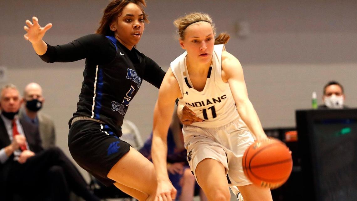 Keller guard Renee Chmiel (11) drives past North Crowley guard Kayla Thompson (5) during the second half of a Division 6A Region 1 quarterfinal basketball game at Arlington ISD Complex in Arlington, Texas, Thursday, Feb. 25, 2021. Keller defeated North Crowley 76-66. (Special to the Star-Telegram Bob Booth)