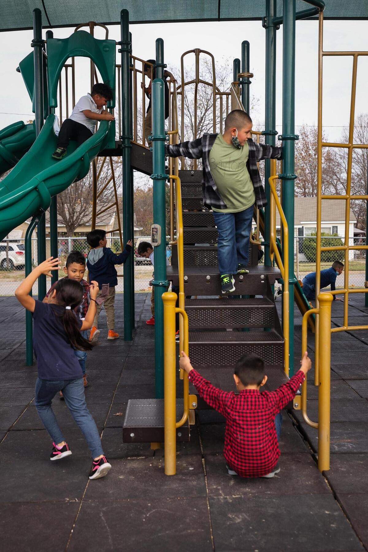 Children play in the playground Friday, Dec. 10, 2021, at W.J. Turner Elementary School in Fort Worth. The playground is too tall for many of the kids, so the district is letting them design a new one.