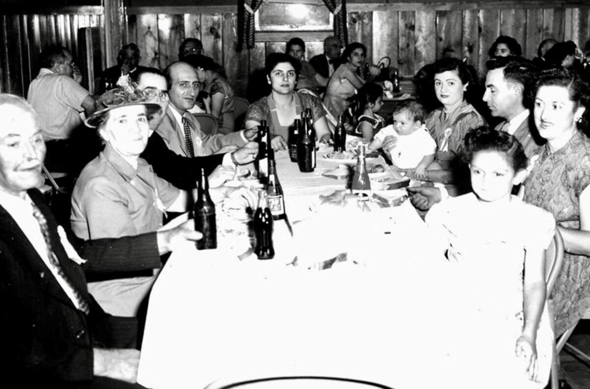 The Phiripes family, founders of George’s Cash & Carry import grocery, at a family baptism on May 17, 1953.