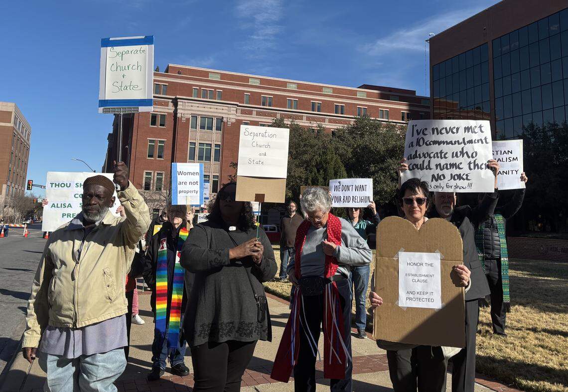 The Faith and Justice Coalition of Tarrant County organized a protest in opposition to the Ten Commandments monument being installed at the Tarrant County Courthouse on Jan. 16, 2026. About 15 interfaith leaders and county residents peacefully stood with signs.