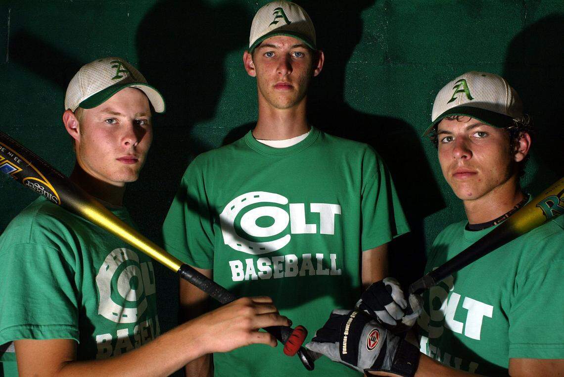 Chris Martin, center, was flanked by Andy Sauter and Jeff Storms in this 2004 photo during their senior season at Arlington High School.