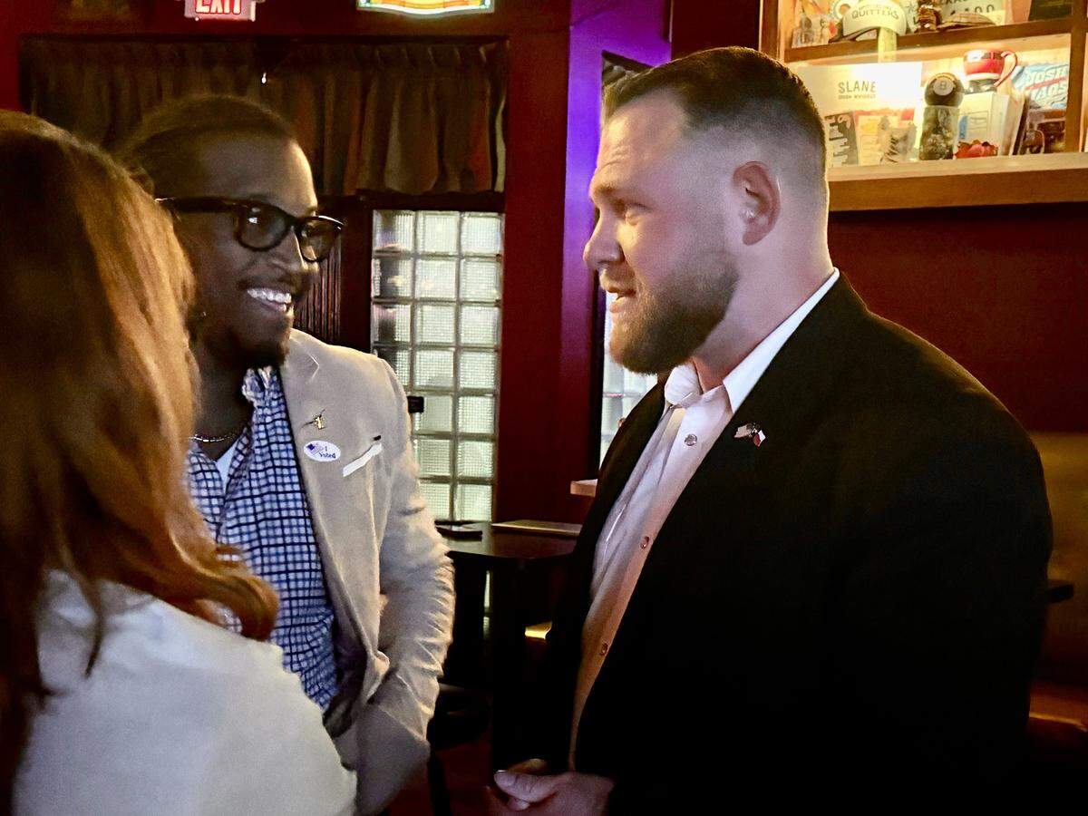 Democrat Taylor Rehmet meets with supporters at his watch party at Nickel City in Fort Worth on Tuesday, Nov. 4, 2025. Rehmet is headed for a runoff for the District 9 Senate seat.