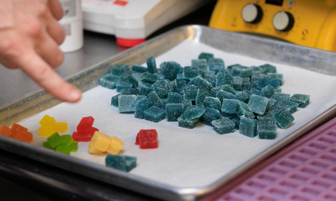 Eric Evans, director of manufacturing at Goodblend, shows the different gummies available to patients during a tour on Thursday, May 1, 2025.
