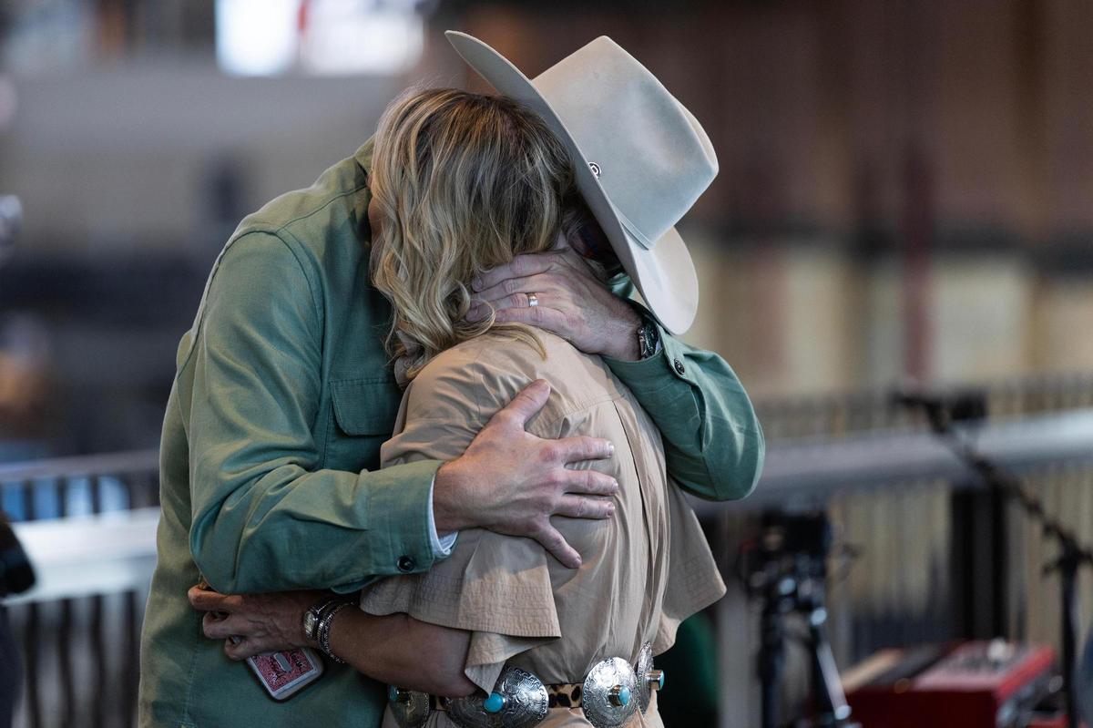 Country music artist Pat Green becomes emotional while hugging his wife Kori during his Pat Green & Friends Flood Relief benefit concert at Globe Life Field in Arlington on Wednesday, July 16, 2025.