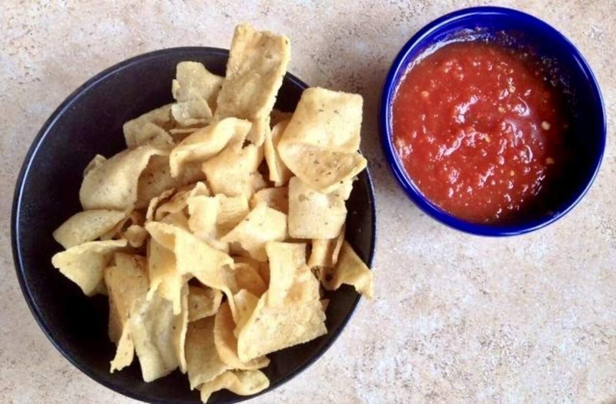 Mexican Inn Cafes’ distinctive chips are like homemade Fritos. The restaurants opened in 1936, not long after Fritos originated in San Antonio in 1932.