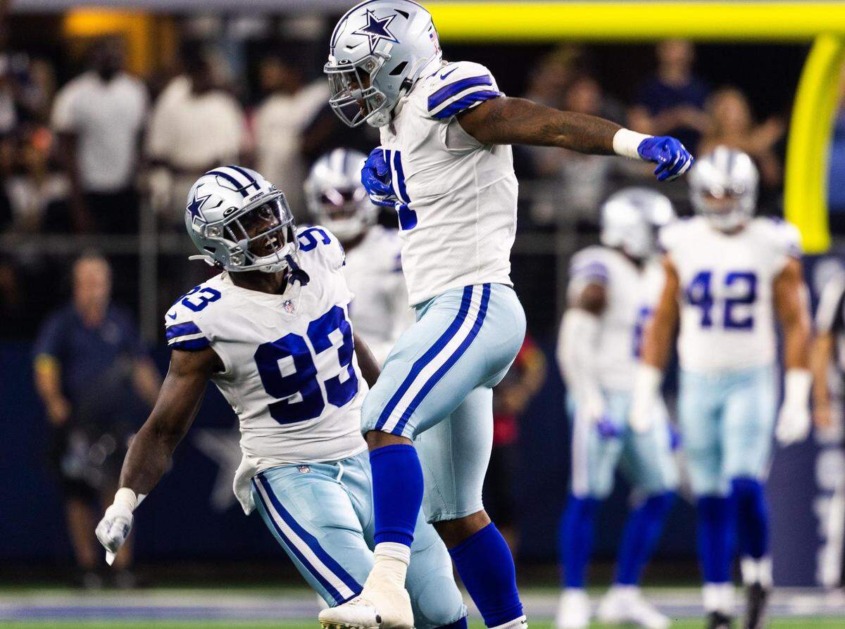 Dallas Cowboys Micah Parsons celebrates a second sack with Tarell Basham during the first half of the game against Tampa Bay Buccaneers Sunday, Sept. 11, 2022, at AT&T Stadium in Arlington.