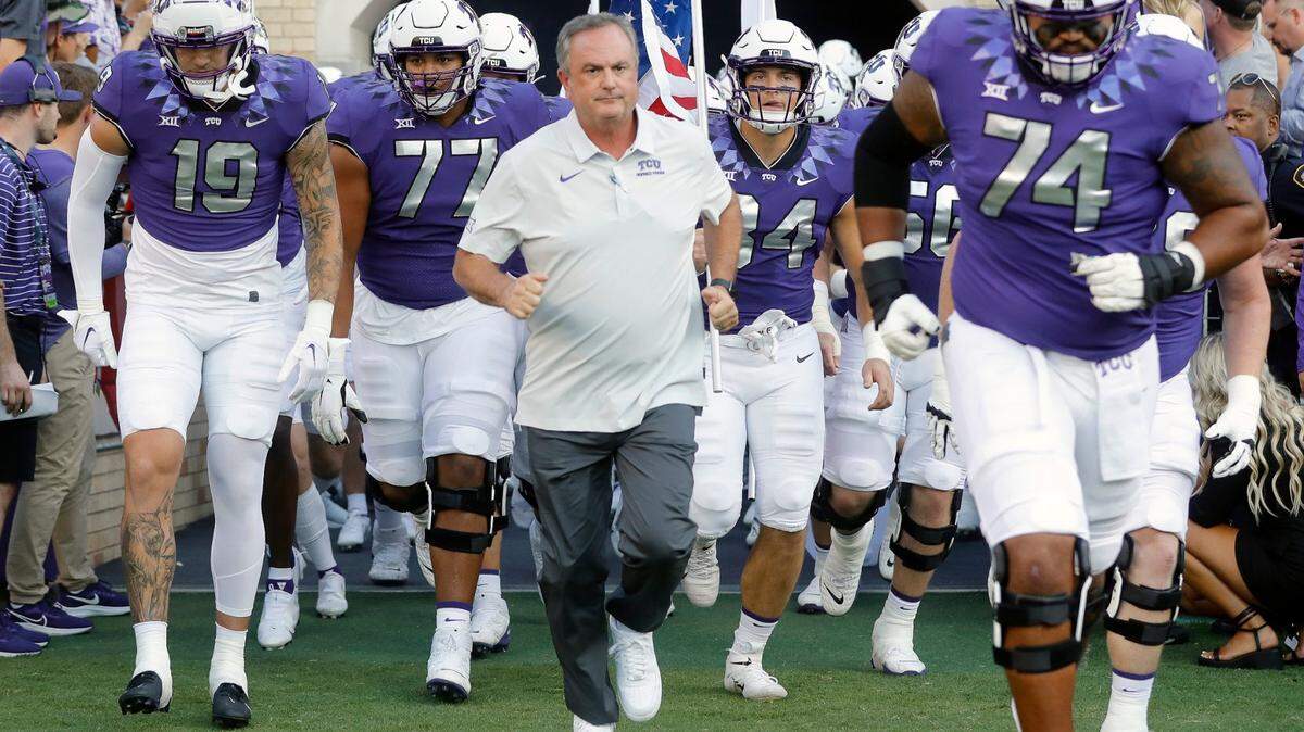 TCU head coach Sonny Dykes brings the team onto the field for the first home game of the season at Amon G. Carter Stadium. (Special to the Star-Telegram Bob Booth)