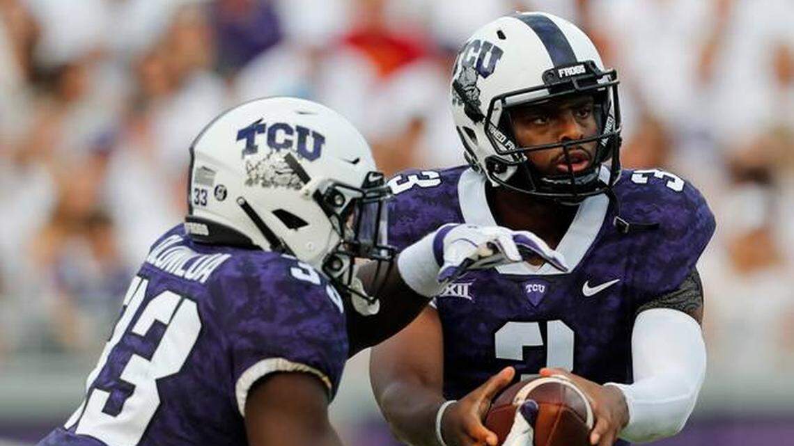 TCU quarterback Shawn Robinson (right) injured his left, non-throwing shoulder against Iowa State.