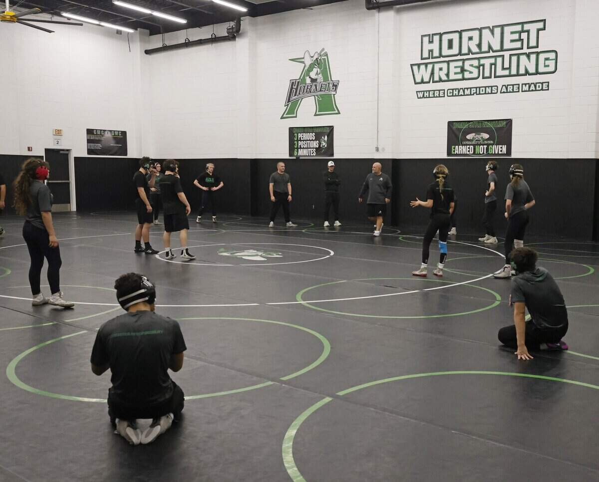 The Azle wrestling team works out five girls and five boys with their two alternates during one of the final practices before the state championship meet at Azle High School in Azle, Texas, on Friday Feb. 9, 2026.