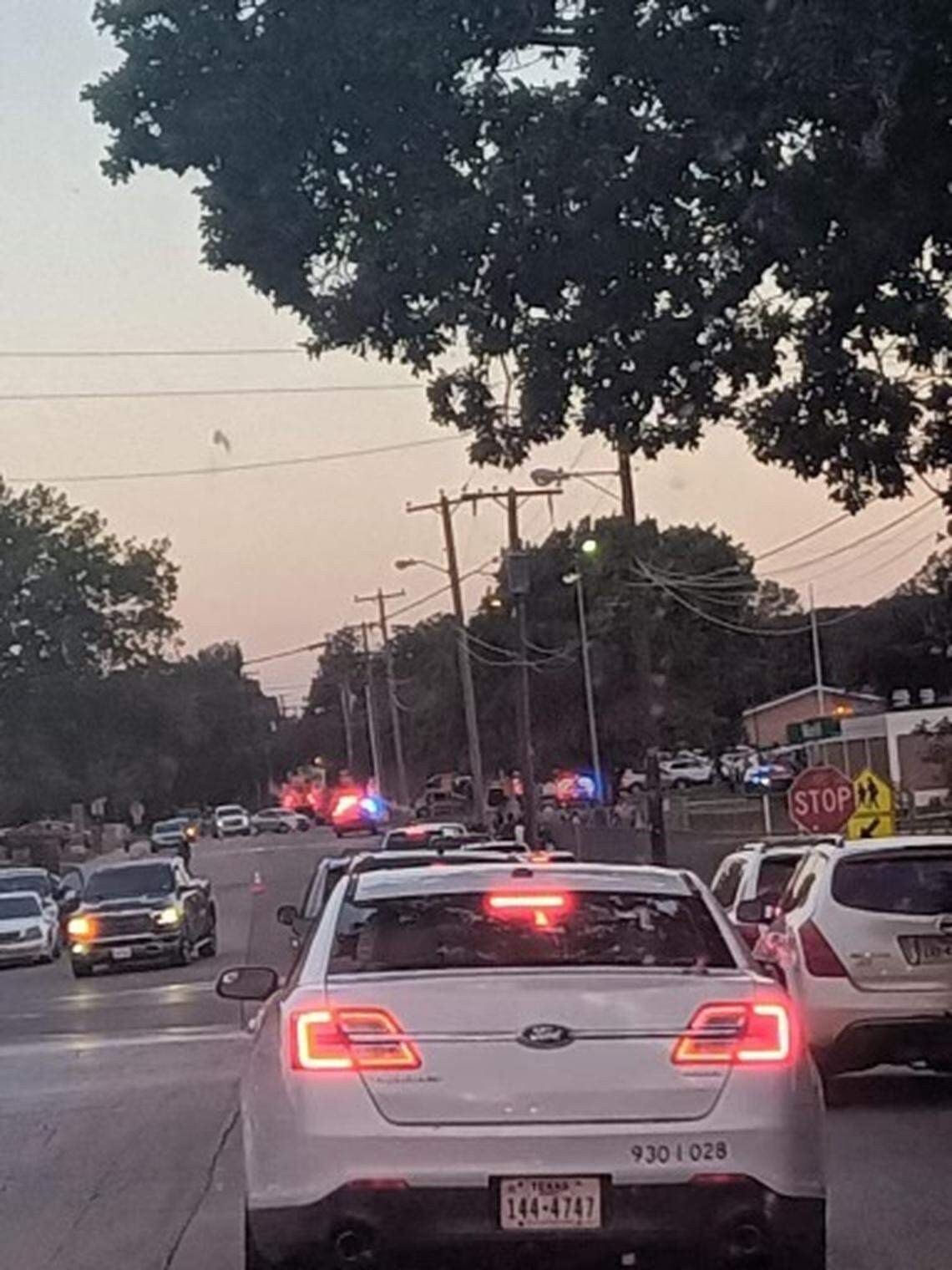 Police respond Wednesday morning, Oct. 11, 2023, to David Sellars Elementary School in Forest Hill, where school officials say a staff member was fatally shot in the back parking lot. The school is part of the Fort Worth Independent School District. 