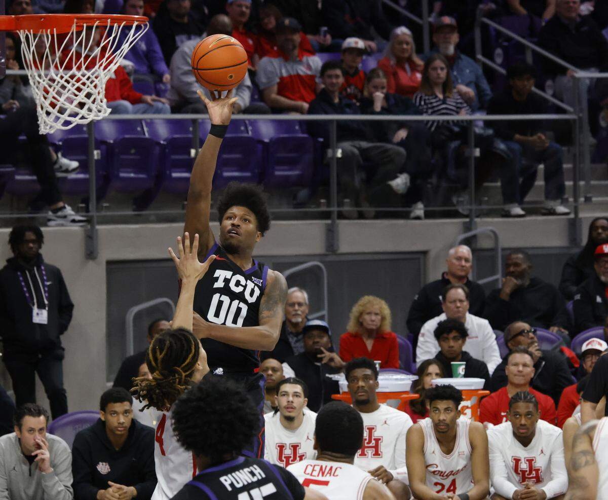 TCU guard Jace Posey (00) shoots over the crowd against Houston during the first half of a NCAA basketball game between the University of Houston and TCU at Schollmaier Arena in Fort Worth, Texas, Wednesday Jan. 26, 2026