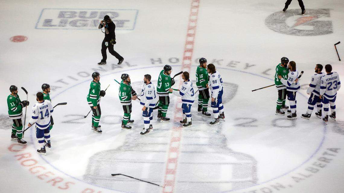 Tampa Bay Lightning and the Dallas Stars players shake hands after the Lightning won Game 6 of the Stanley Cup in Edmonton last month. (Jason Franson/The Canadian Press via AP)