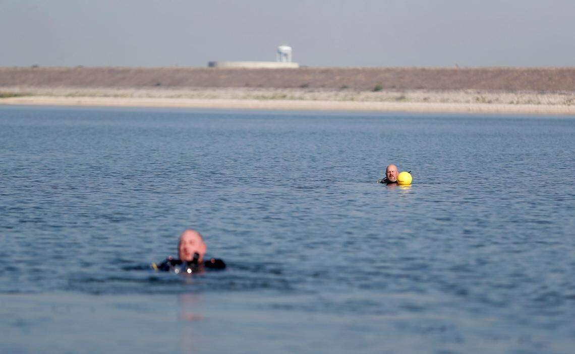 Divers Wayne Spears, left, and David Wardlaw prepare to search for the third and final submerged car in Benbrook Lake, located over 30 feet underwater on Monday, September 16, 2019. North Texas Marine Salvage & Recovery’s dive team volunteered to assist Rusty Arnold in retrieving the cars from the bottom of the lake in his search for clues to his sister’s 1974 disappearance.
