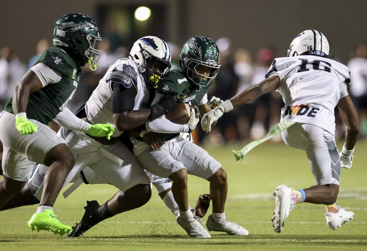 North Crowley defense brings down Waxahachie running back Jordan Smith (1) during the first half of the game against North Crowley on Friday, Oct. 9, 2026, at Stuart B. Lumpkins Stadium in Waxahachie.