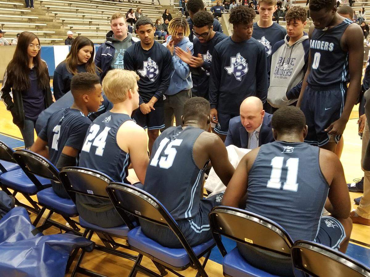 L.D. Bell coach Brock Pembleton draws up a play during the Blue Raiders 77-66 bi-district win over Arlington Bowie at Grand Prairie High School. Feb. 18, 2019.