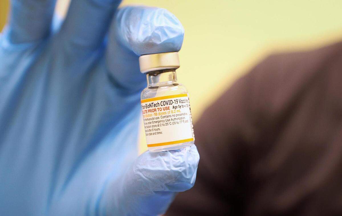 In this 2021 file photo, nurse Adrian Rodriguez holds a vial of the pediatric COVID-19 vaccine at Lone Star Children’s Medical Clinic at La Gran Plaza.