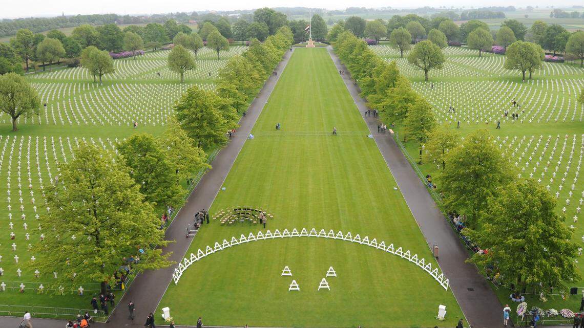 Families visit the Netherlands American Cemetery and Memorial on May 30, 2010, in Margraten. The site was established as a battlefield cemetery on Nov. 10, 1944, by the Ninth U.S. Army. The cemetery interred 8,302 American soldiers who gave their lives in the airborne and ground operations to liberate eastern Holland during the advances into Germany over the Roer River and across the Rhine River, and in air operations over the region.