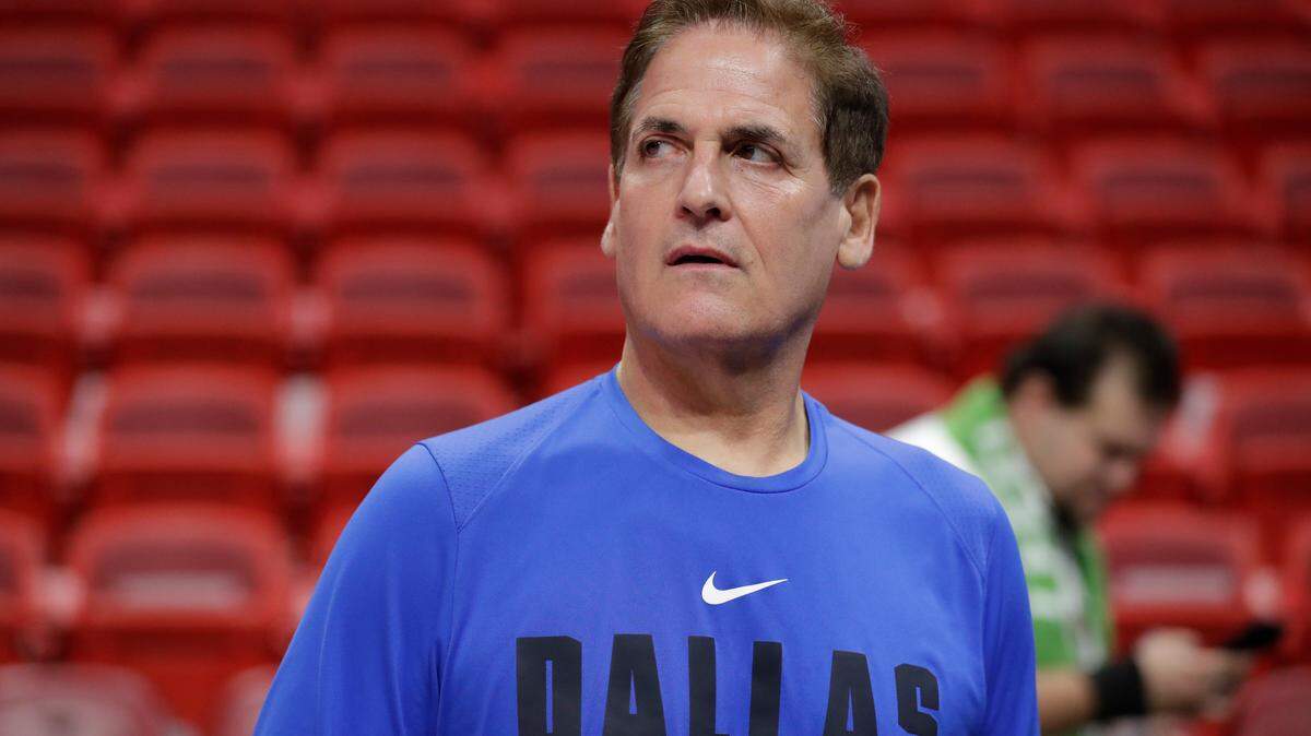 Dallas Mavericks owner Mark Cuban watches players warm up before the start of an NBA basketball game against the Miami Heat, Friday, Feb. 28, 2020, in Miami. (AP Photo/Wilfredo Lee)