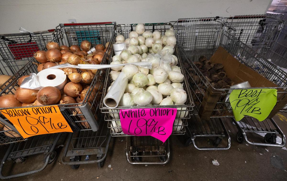 Produce for sale sits in carts at Town Talk Foods on Monday, April 21, 2025, in Fort Worth. Shoppers can expect to get groceries for a minimum of 50 percent off said owner Tom Brown.