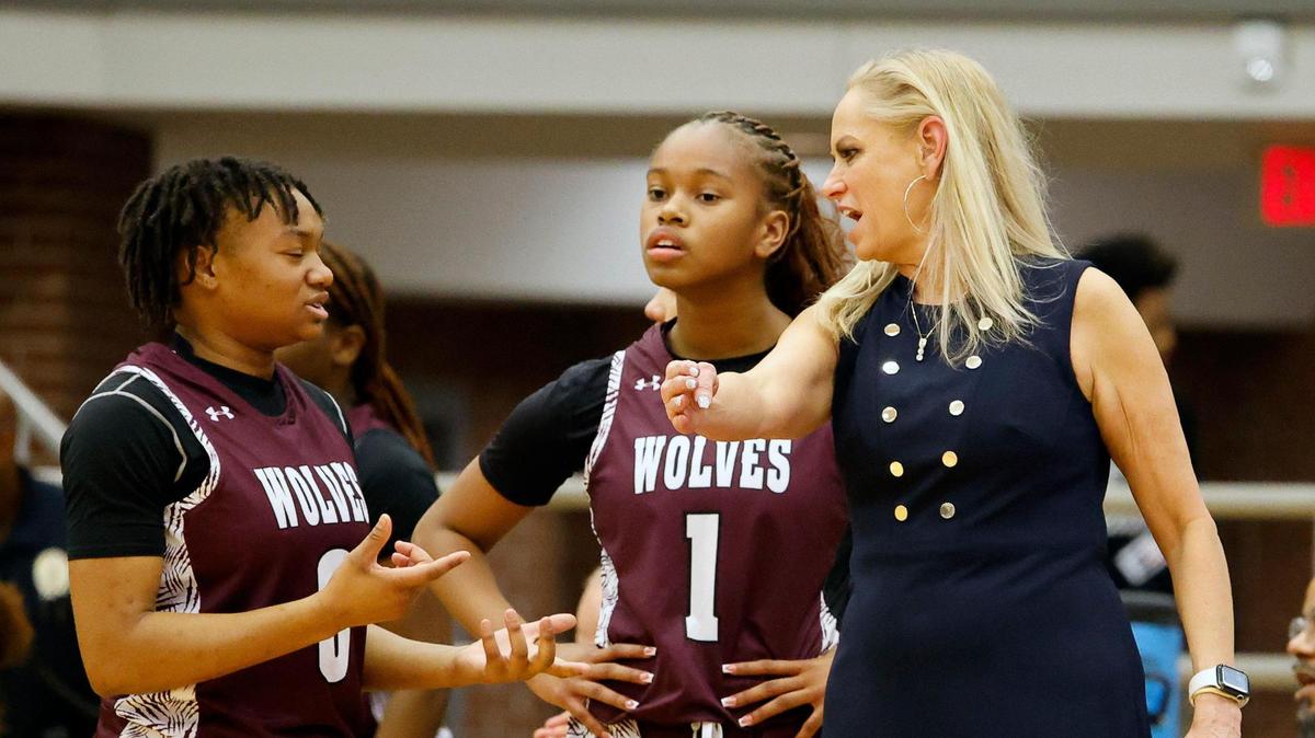 Timberview head coach Kit Martin gives some one-on-one coaching at the end of the first half of a high school basketball game at Summit High School in Mansfield, Texas, Tuesday, Jan, 30, 2024.