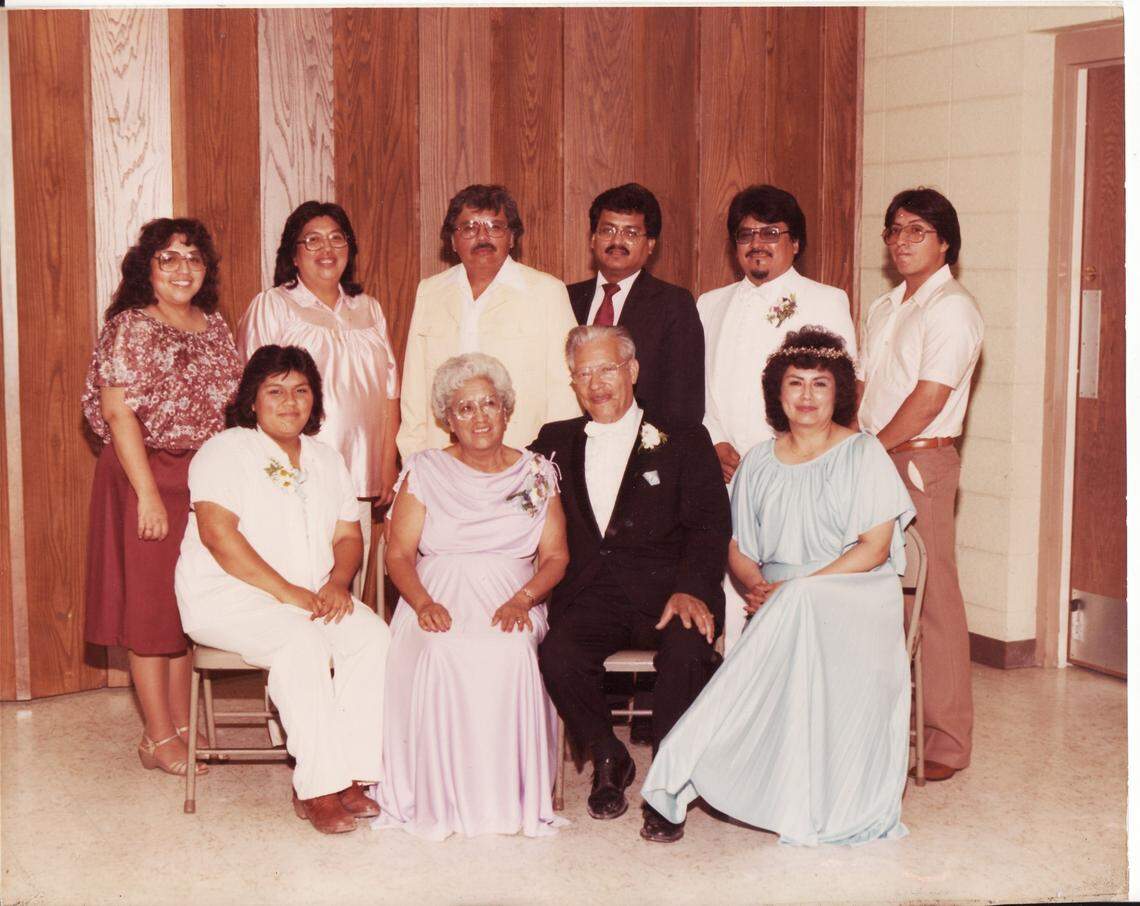 The Martinez family celebrates the wedding of David Martinez on July 13, 1982. Back row, L-R Stella Briebiesca, Connie Ybarra, Edward Martinez, Julian Martinez, David Martinez, and Ernesto Martinez. Front Row, L-R Cynthia Martinez, Santos Martinez, Jim Martinez, Ruby Curiel.