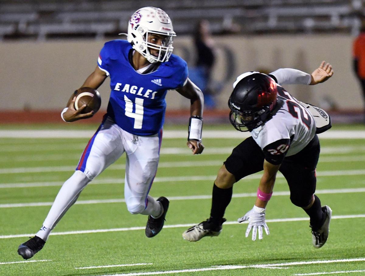 Carter-Riverside quarterback Jayden Thomas, left escapes Diamond Hill-Jarvis’s Moses Reyes as he runs for a big first down in the second quarter of Thursday’s October 27, 2022 District 6-4A Division 1 football game at Farrington Field in Fort Worth, Texas. Special/Bob Haynes
