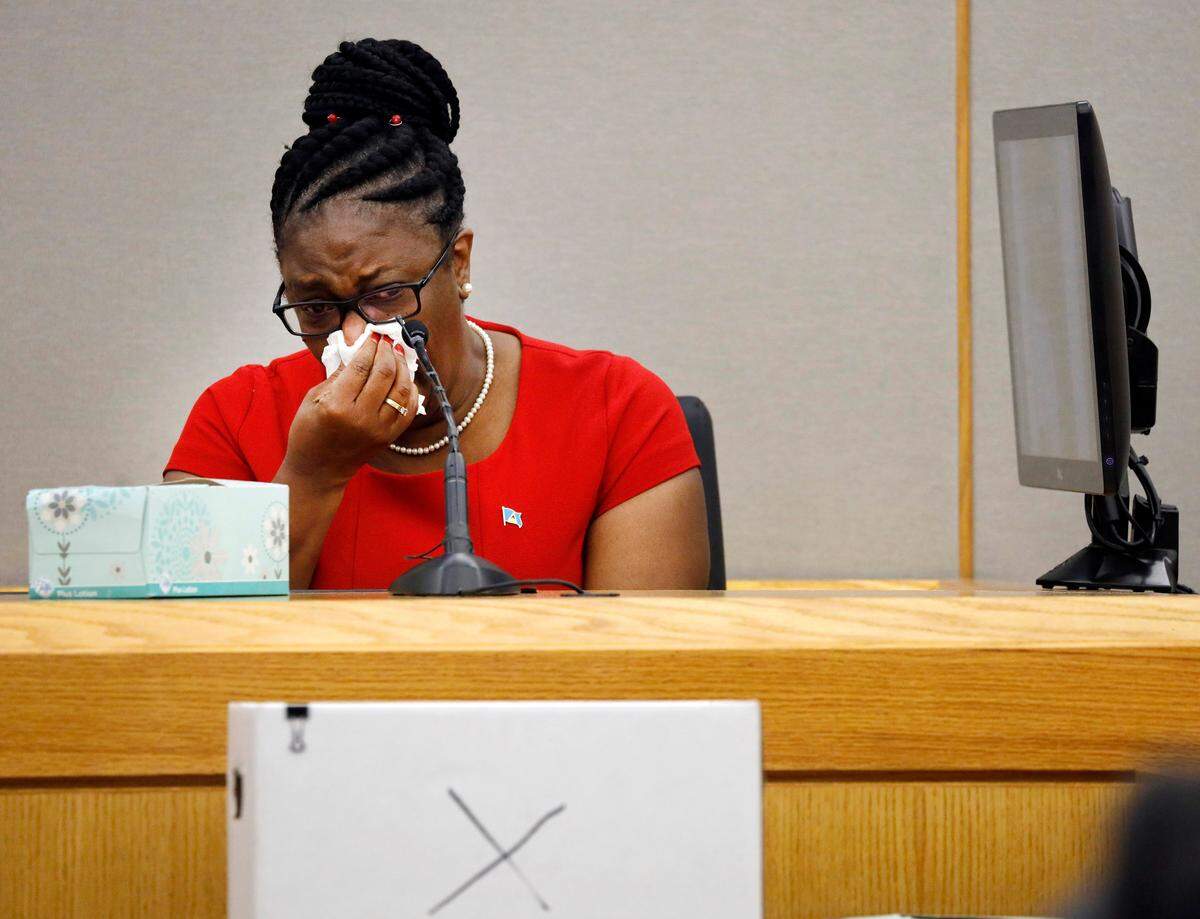 Botham Jean’s mother, Allison Jean, cries while speaking about her son during sentencing testimony for former Dallas Police Officer Amber Guyger in 204th District Court at the Frank Crowley Courts Building in Dallas, Tuesday, Oct. 1, 2019. Guyger, who shot her black unarmed neighbor Botham Jean to death after, she said, mistaking his apartment for her own, was convicted of murder Tuesday. (Tom Fox/The Dallas Morning News via AP, Pool)