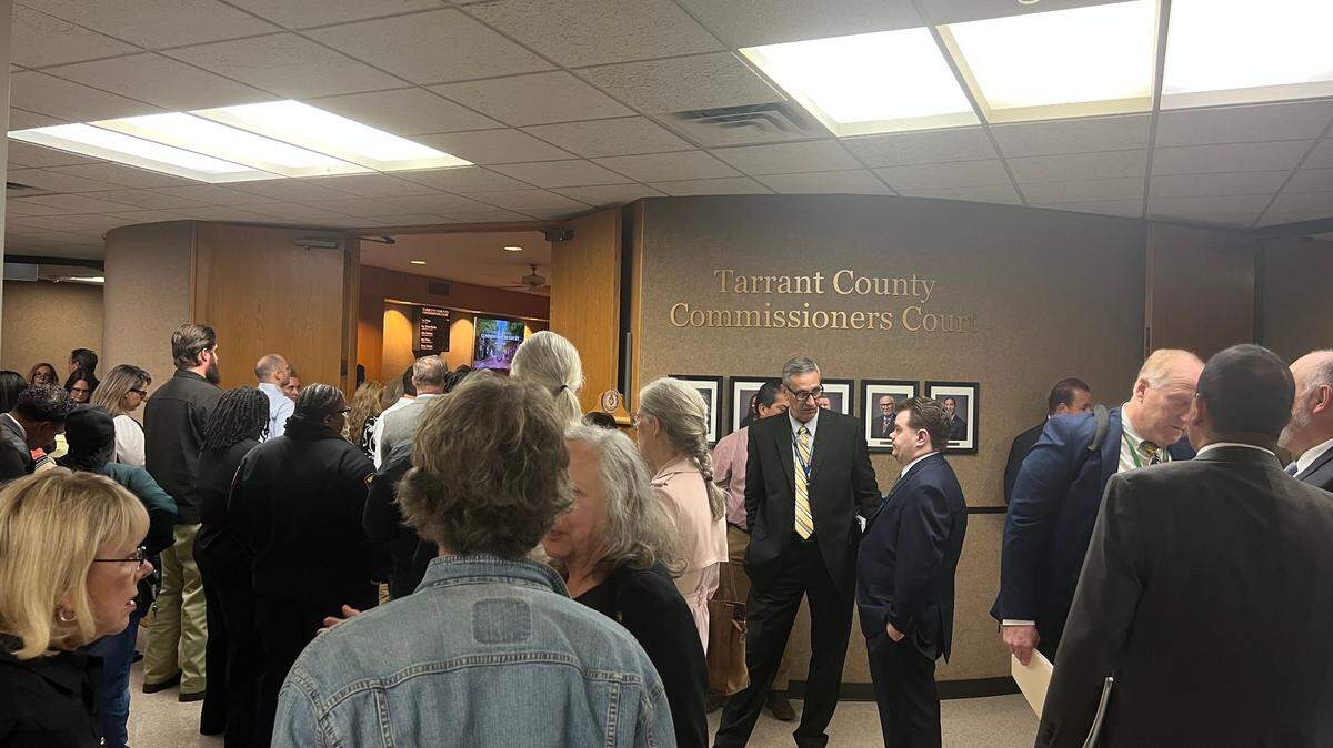 Attendees, many of whom work in criminal defense, wait to be let into the Tarrant County Commissioners court on Tuesday.