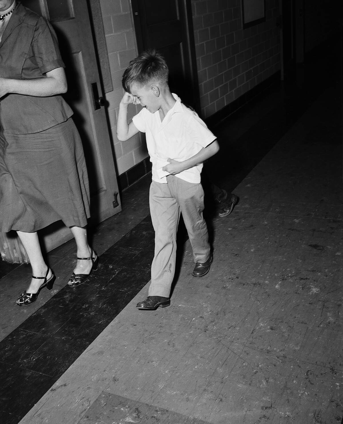 Sept. 7, 1954: Six-year-old Ronnie Harrison cried as his mother carried him from his first day at Crestwood Elementary School. Ronnie is the son of Master Sergeant and Mrs. Raymond Harrison of Carswell Air Force Base.