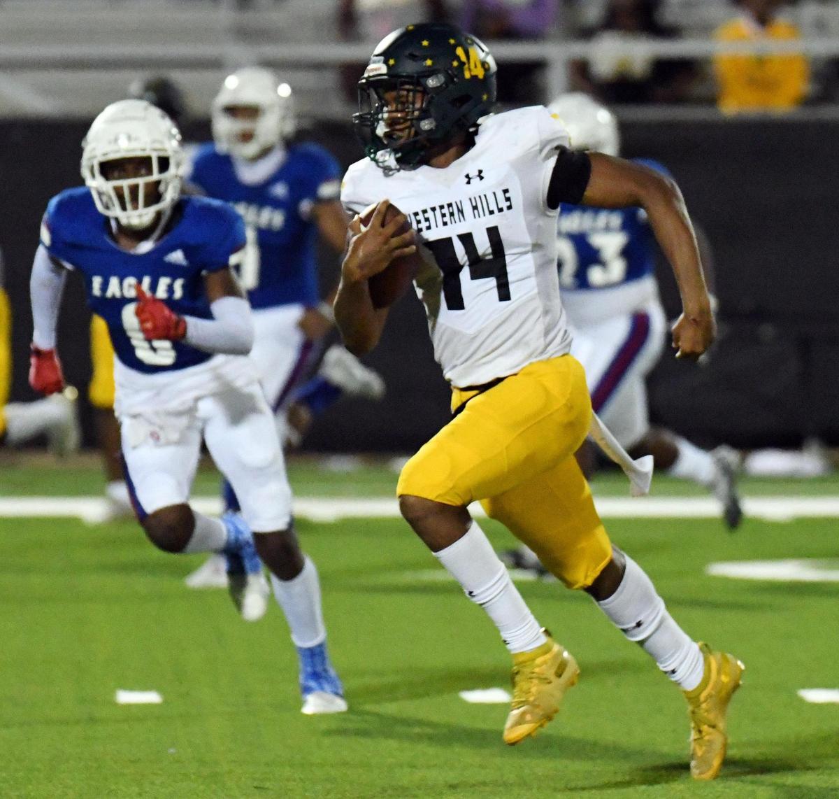 Western Hills quarterback Keyon Butler, right, breaks into the open field past Carter-Riverside’s Areyon Martin for a 56 yard touchdown run to give the Cougars a 50-30 lead late in the fourth quarter of Thursday’s September 22, 2022 District 6-4A Division 1 football game at Scarborough Handley Field in Fort Worth, Texas. Western Hills won 50-30. Special/Bob Haynes
