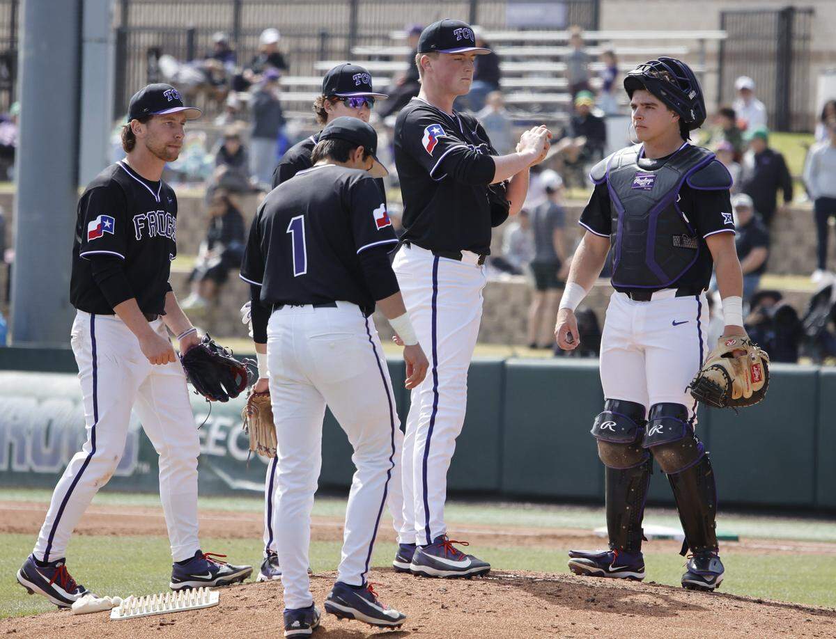 TCU pitcher Uli Fernsler (41) and the infield wait for head coach Kirk Saarloos to relieve Fernsler during an NCAA baseball game at Lupton Field at TCU in Fort Worth, Texas, Tuesday, March, 17, 2026.