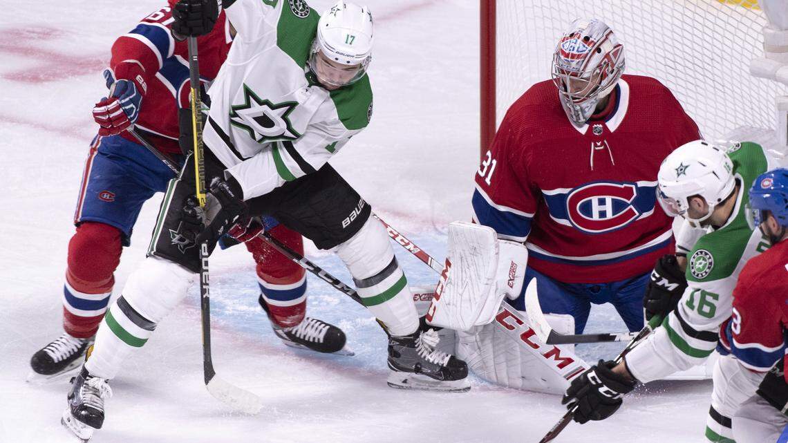 Dallas Stars’ Devin Shore, second from left, tries to take control of the puck in front of Montreal Canadiens goaltender Carey Price during the first period, Tuesday, Oct. 30, 2018, in Montreal.