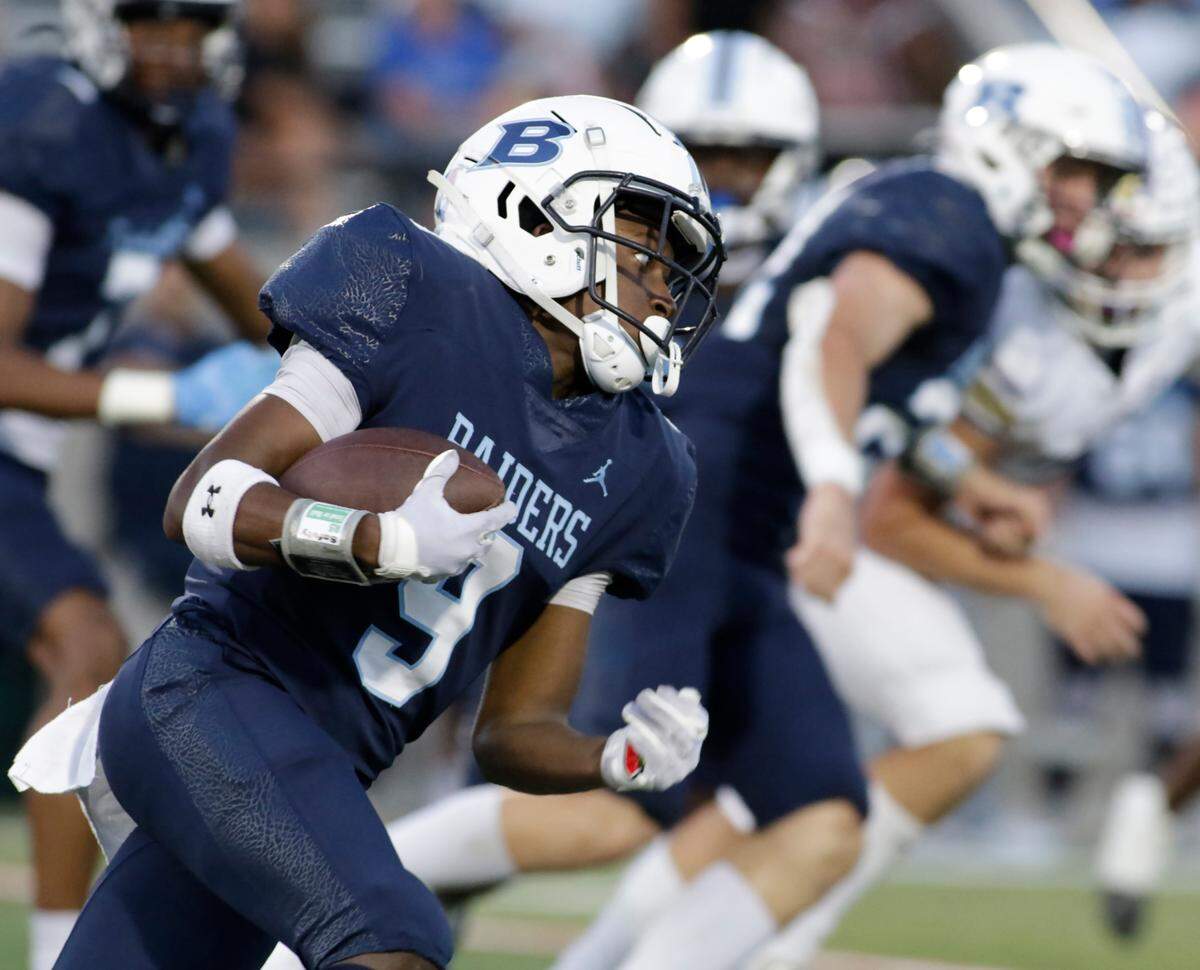 L.D. Bell’s Caleb Walton returns a kickoff against Timber Creek during their UIL football game Friday night at Pennington Field in Hurst on Friday Sept. 6, 2024.